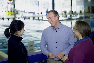 Kieran talking with residents