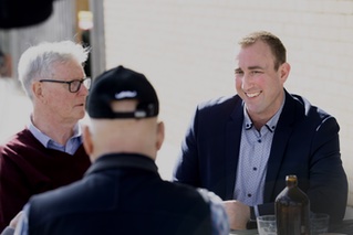 Kieran talking with residents